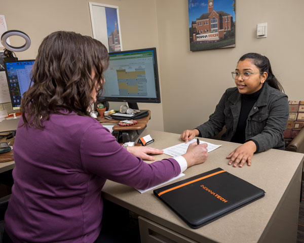 Student sitting with an advisor